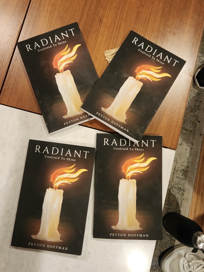 RADIANT books on table